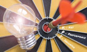 KPI key performance indicator with idea bulb lamp and dart successful on bullseye, Smart goals concept for success business